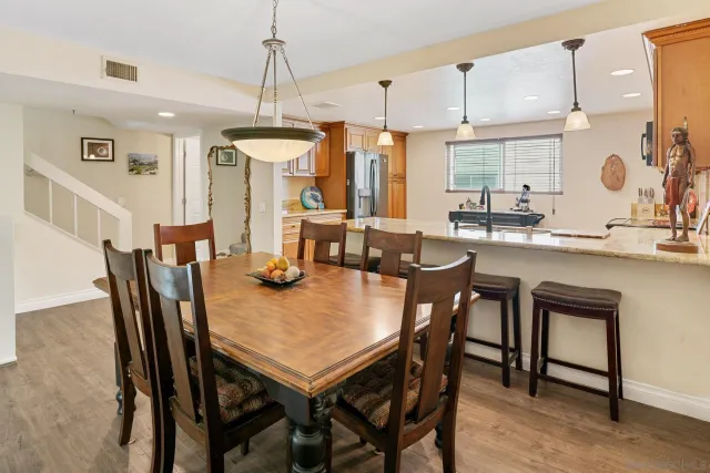 a kitchen with a table and chairs in it
