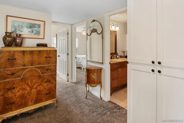 a bathroom with a sink a toilet and shower curtain