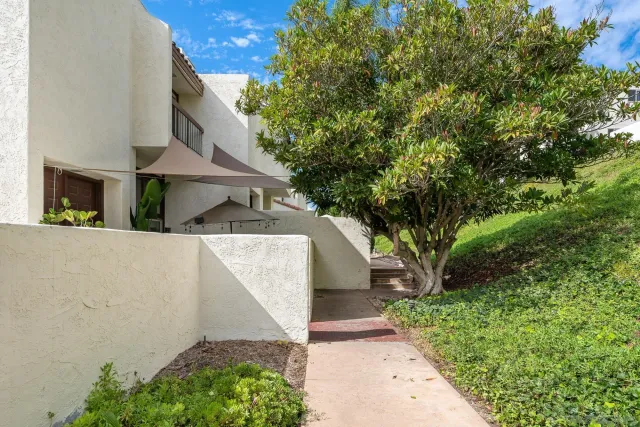 a view of the house with a yard