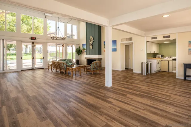 a view of dining room with furniture and wooden floor