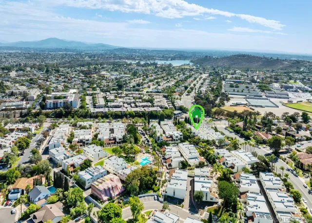 an aerial view of residential houses and street
