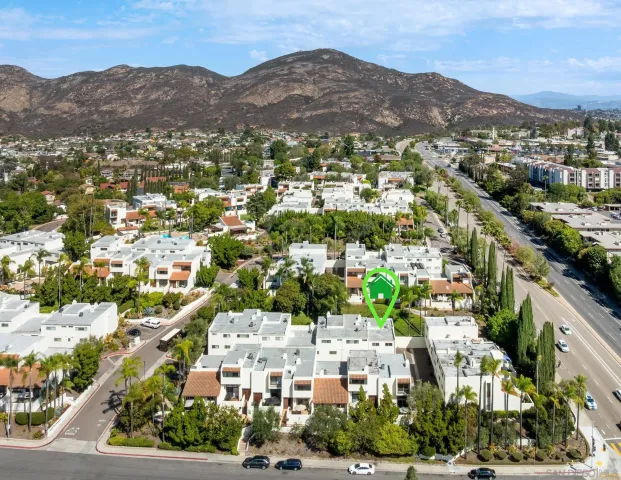 a front view of a house with trees