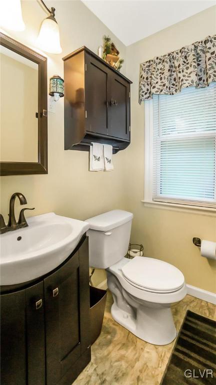 2341 Highland Street Reading, PA 19609 - Photo 13 of 36 a bathroom with a toilet sink and mirror