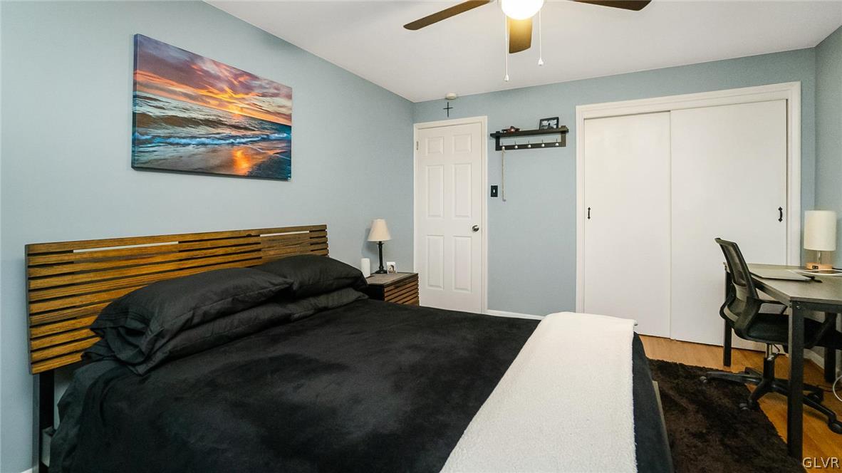 2341 Highland Street Reading, PA 19609 - Photo 16 of 36 a bedroom with a bed and a chandelier