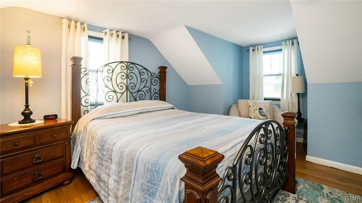 2341 Highland Street Reading, PA 19609 - Photo 17 of 36 a bedroom with a bed and a chandelier