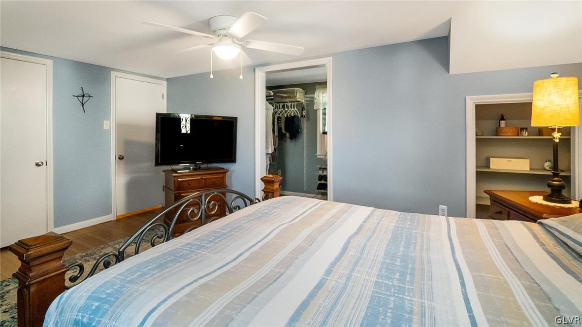 2341 Highland Street Reading, PA 19609 - Photo 18 of 36 a bedroom with a bed and a flat tv screen on dresser