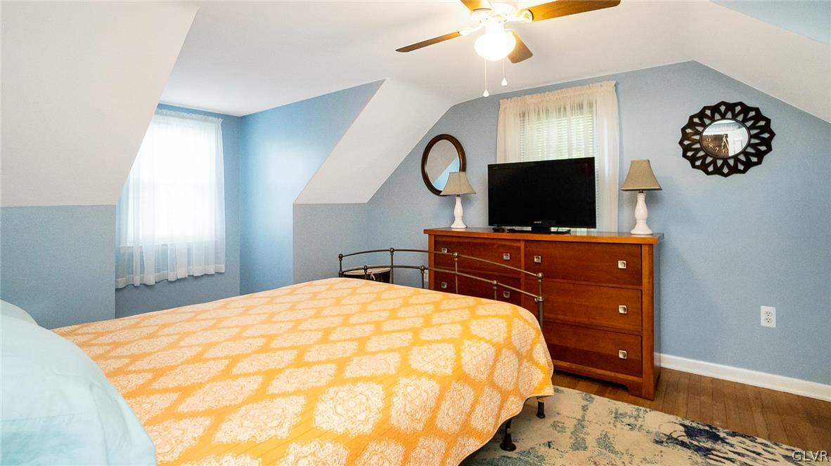 2341 Highland Street Reading, PA 19609 - Photo 23 of 36 a bedroom with a bed and a flat tv screen on dresser