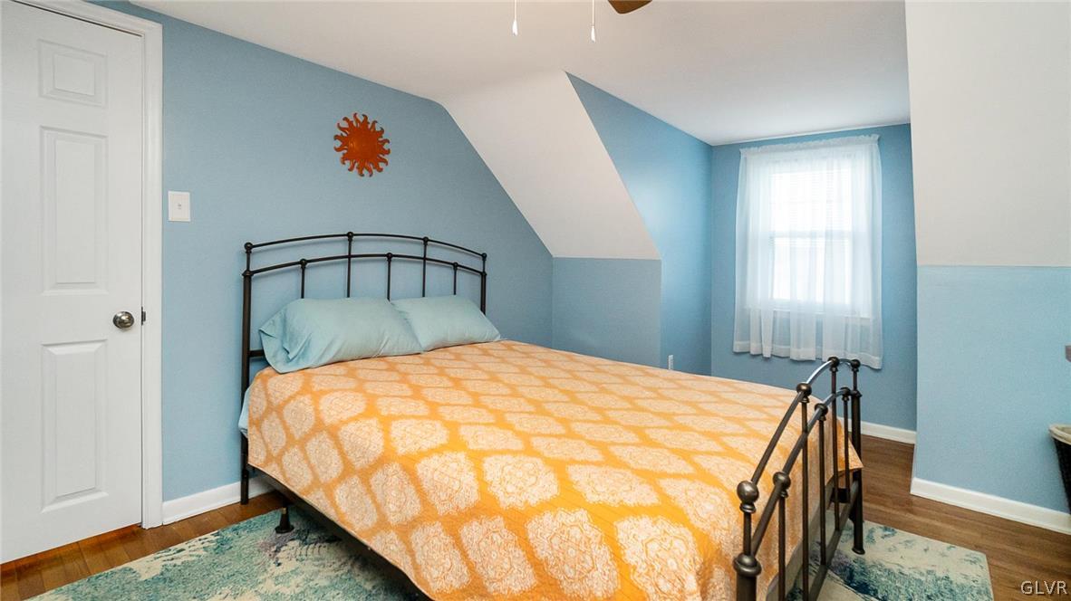 2341 Highland Street Reading, PA 19609 - Photo 24 of 36 a bed sitting in a bedroom next to a window