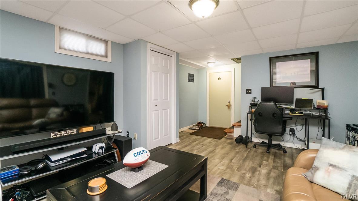 2341 Highland Street Reading, PA 19609 - Photo 25 of 36 a living room with furniture flat screen tv and gym equipment