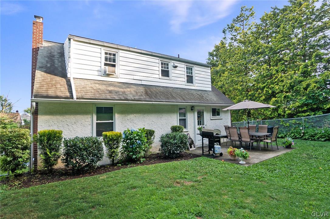 2341 Highland Street Reading, PA 19609 - Photo 35 of 36 a patio with a table and chairs under an umbrella
