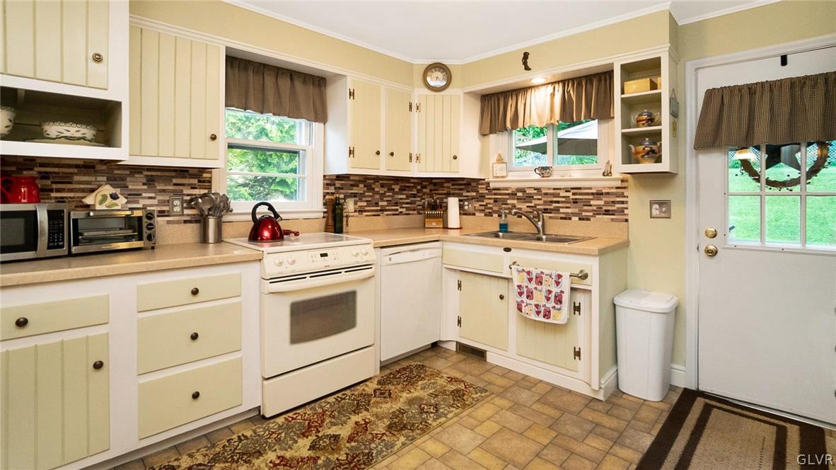 2341 Highland Street Reading, PA 19609 - Photo 9 of 36 a kitchen with stainless steel appliances a stove a sink and a refrigerator