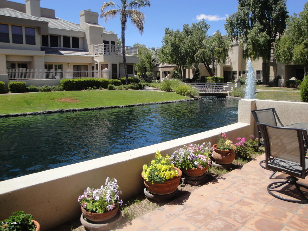 7272 East Gainey Ranch Road, Unit 124 Scottsdale, AZ 85258 - Photo 1 of 36 UNIT FACES WATER LAGOON