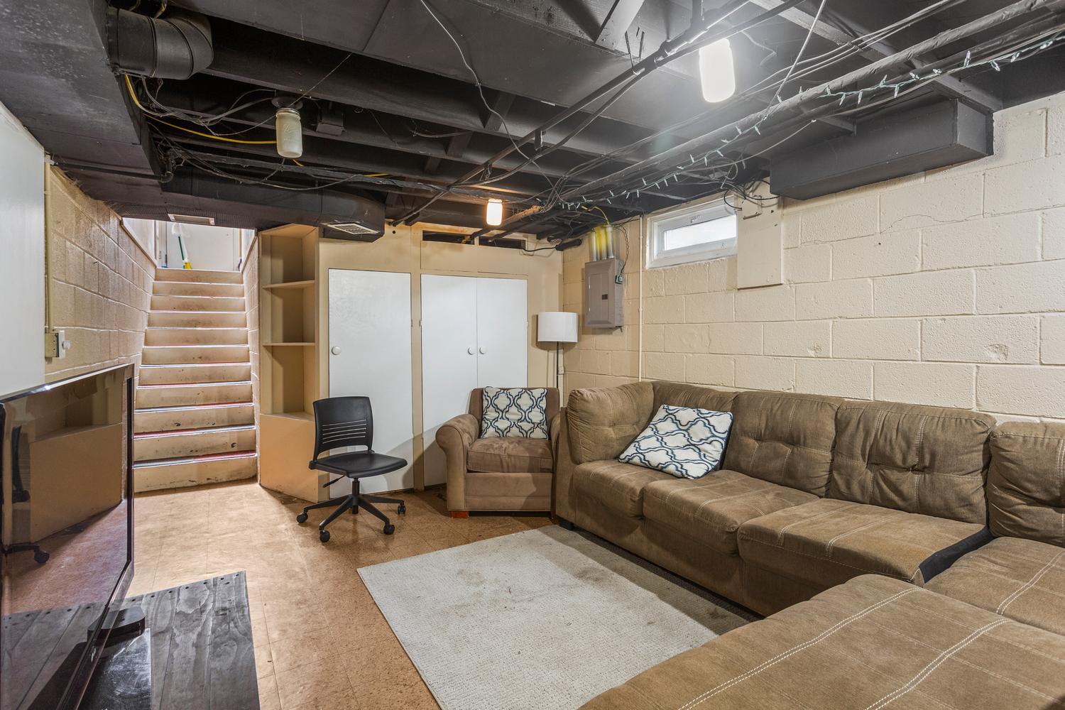 1117 West Union Street Champaign, IL 61821 - Photo 23 of 29 a view of a livingroom with workspace and a couch