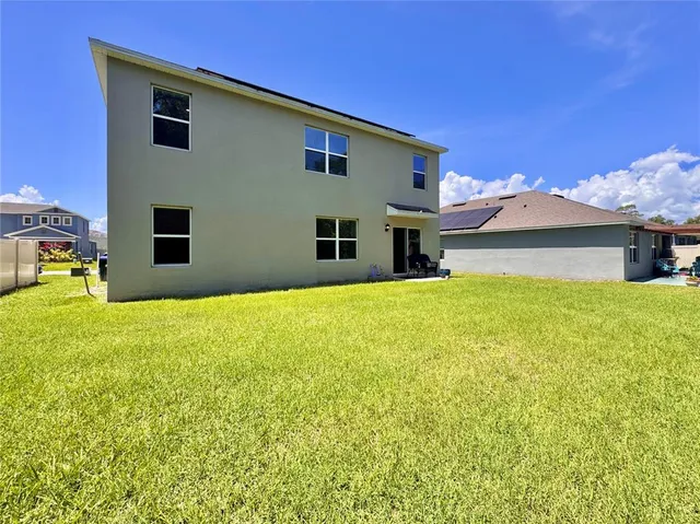 a front view of house with an outdoor space and seating