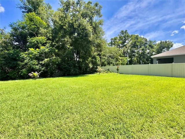 a view of yard and swimming pool