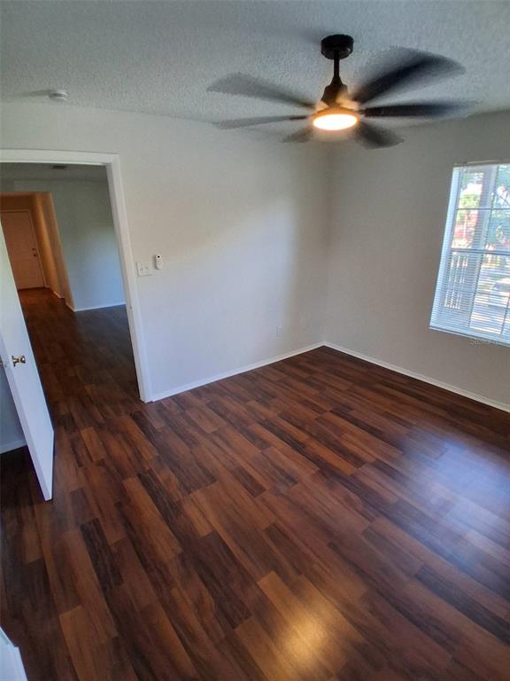 208 Afton Square, Unit 201 Altamonte Springs, FL 32714 - Photo 16 of 38 wooden floor in an empty room with a window