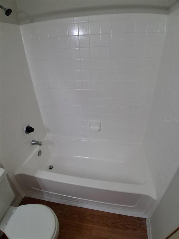 208 Afton Square, Unit 201 Altamonte Springs, FL 32714 - Photo 20 of 38 a bathroom with a toilet and a shower view