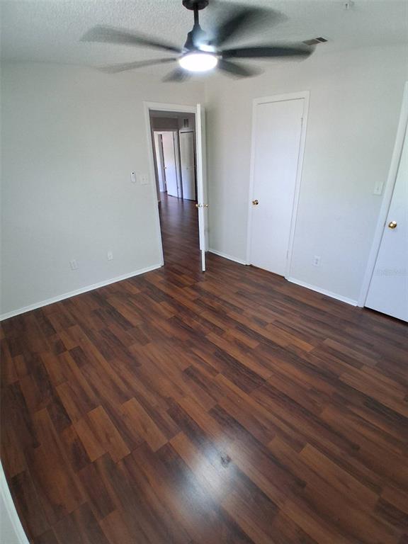 208 Afton Square, Unit 201 Altamonte Springs, FL 32714 - Photo 21 of 38 a view of an empty room with wooden floor