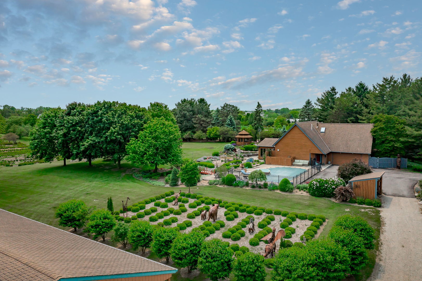 29295 North Callahan Road Wauconda, IL 60084 - Photo 2 of 45 a view of a garden with plants and large trees
