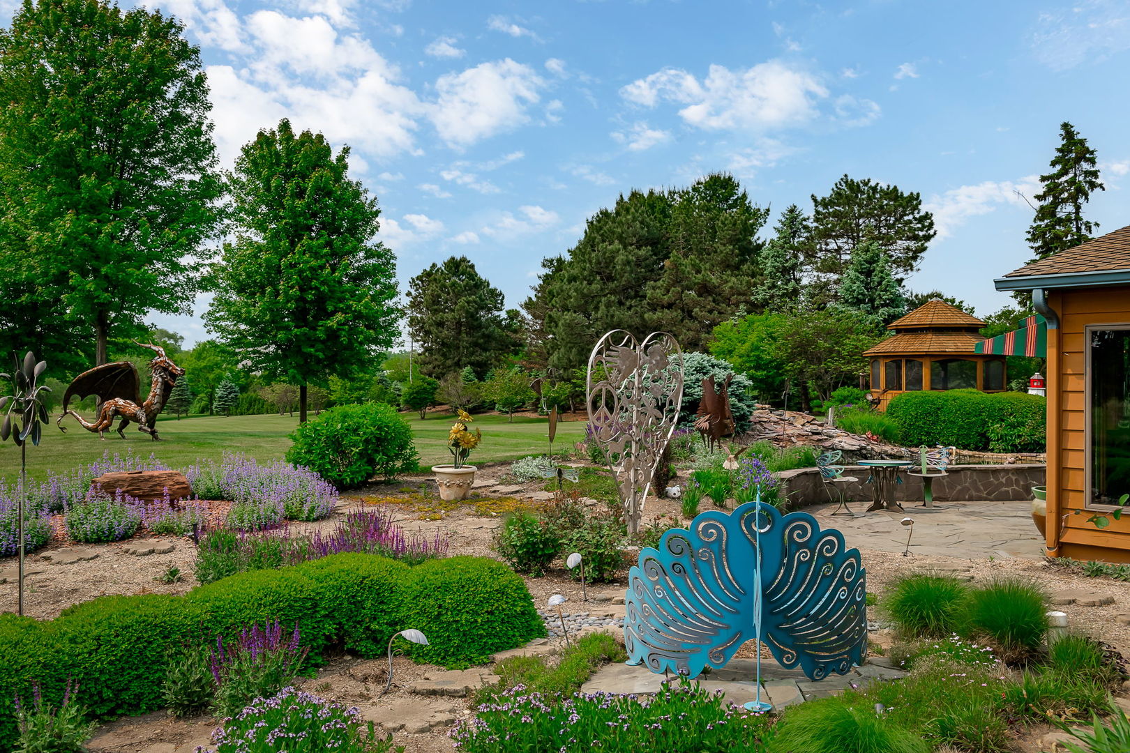 29295 North Callahan Road Wauconda, IL 60084 - Photo 21 of 45 a view of a garden with plants and a fountain