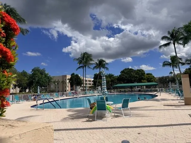 a view of a chairs and table in the patio