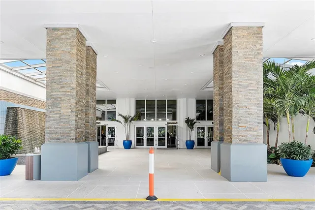 a living room with lots of furniture and a chandelier