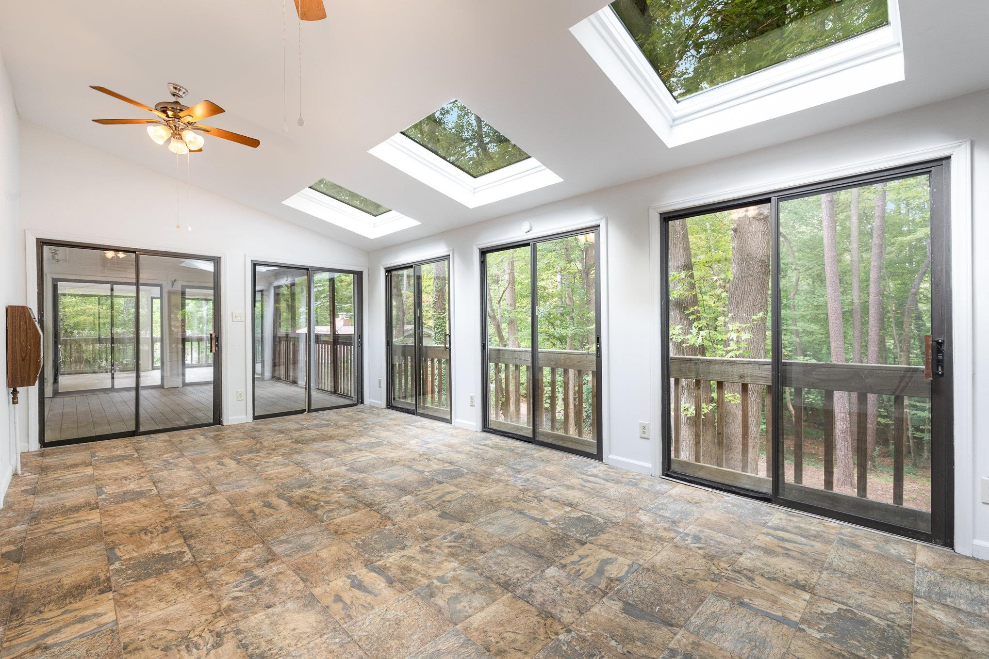 4921 Brookhaven Drive Raleigh, NC 27612 - Photo 12 of 39 Enjoy the vaulted ceiling and natural light year round. Sunroom