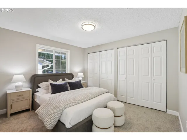 a bedroom with bed and a window