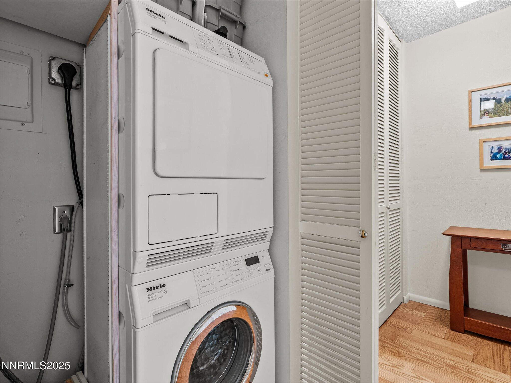 100 North Arlington Avenue, Unit 20J Reno, NV 89501 - Photo 13 of 17 a utility room with dryer and washer