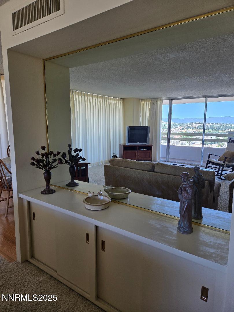 100 North Arlington Avenue, Unit 20J Reno, NV 89501 - Photo 14 of 17 a view of kitchen with granite countertop window