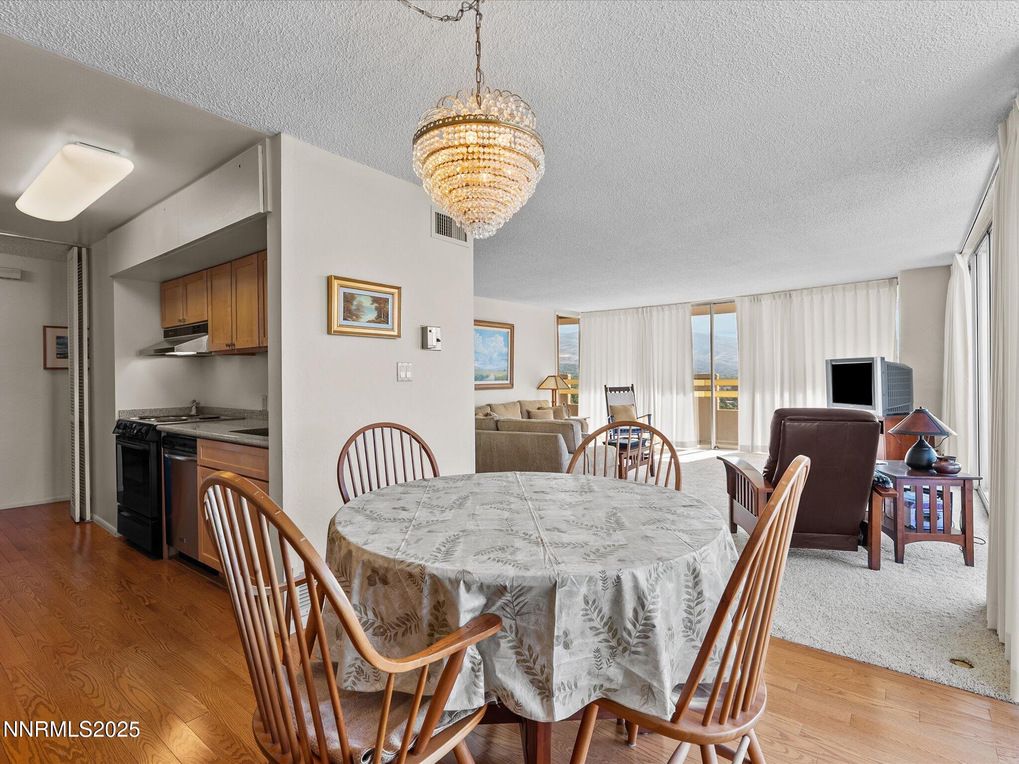 100 North Arlington Avenue, Unit 20J Reno, NV 89501 - Photo 6 of 17 a view of a dining room with furniture