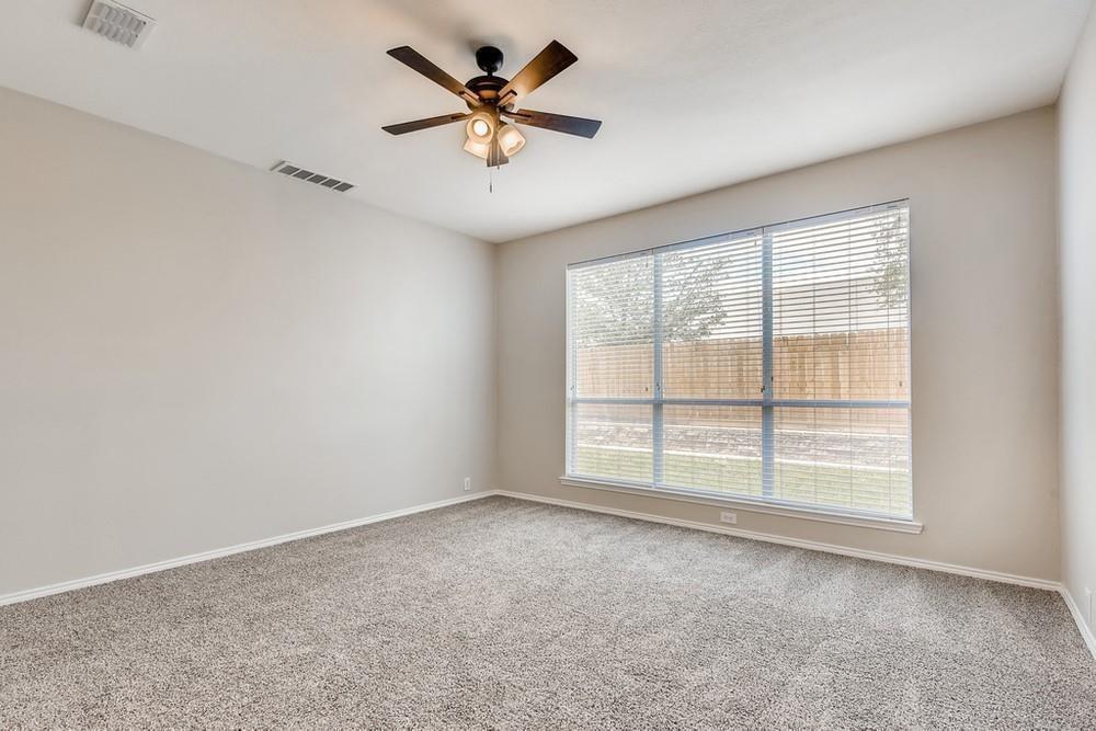 9937 Appletree Way Fort Worth, TX 76244 - Photo 18 of 25 an empty room with a empty space and a ceiling fan
