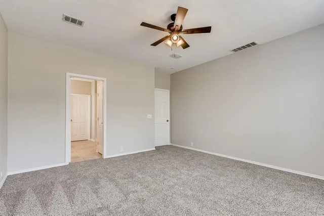 a view of room with ceiling fan