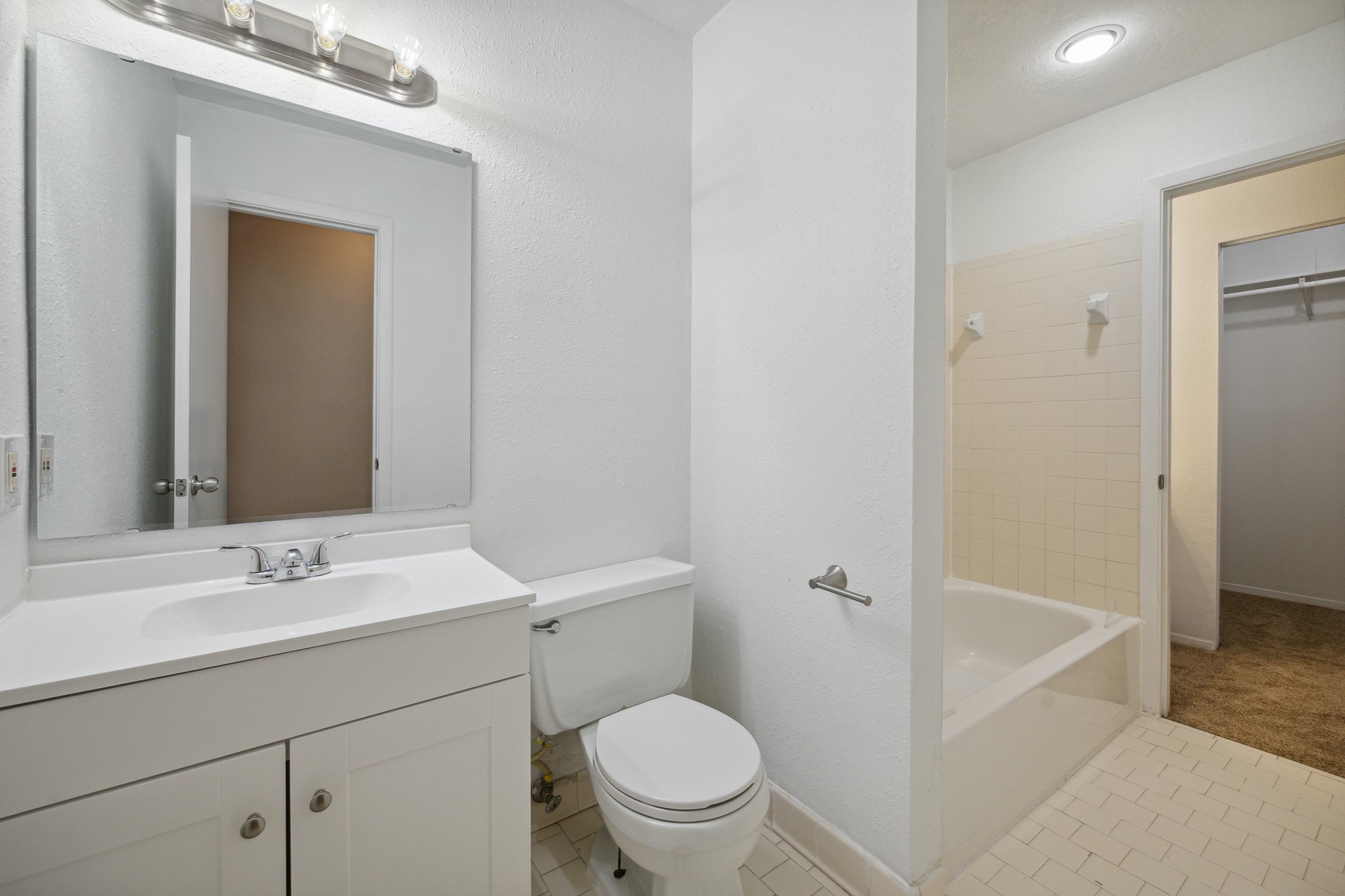 3606 Ocee Street Houston, TX 77063 - Photo 12 of 16 a bathroom with a sink a toilet and shower