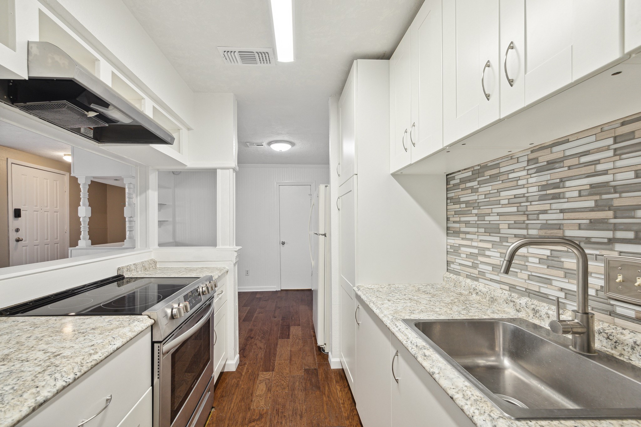 3606 Ocee Street Houston, TX 77063 - Photo 8 of 16 a kitchen with a sink stove and cabinets