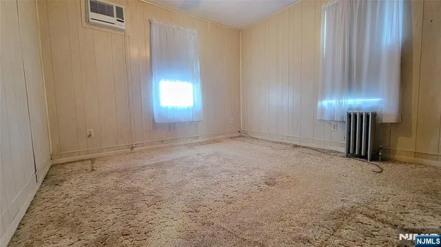an empty room with a fireplace