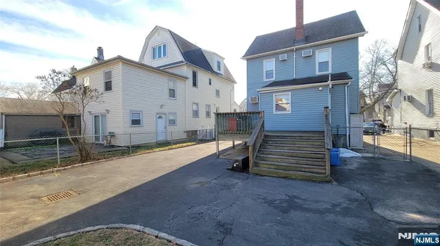 a view of a house with a yard and garage