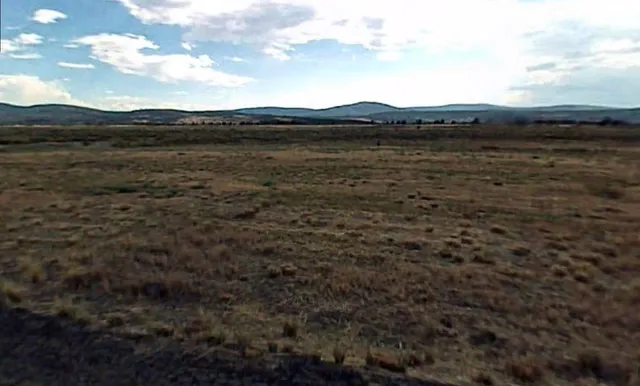 a view of mountain with lake view