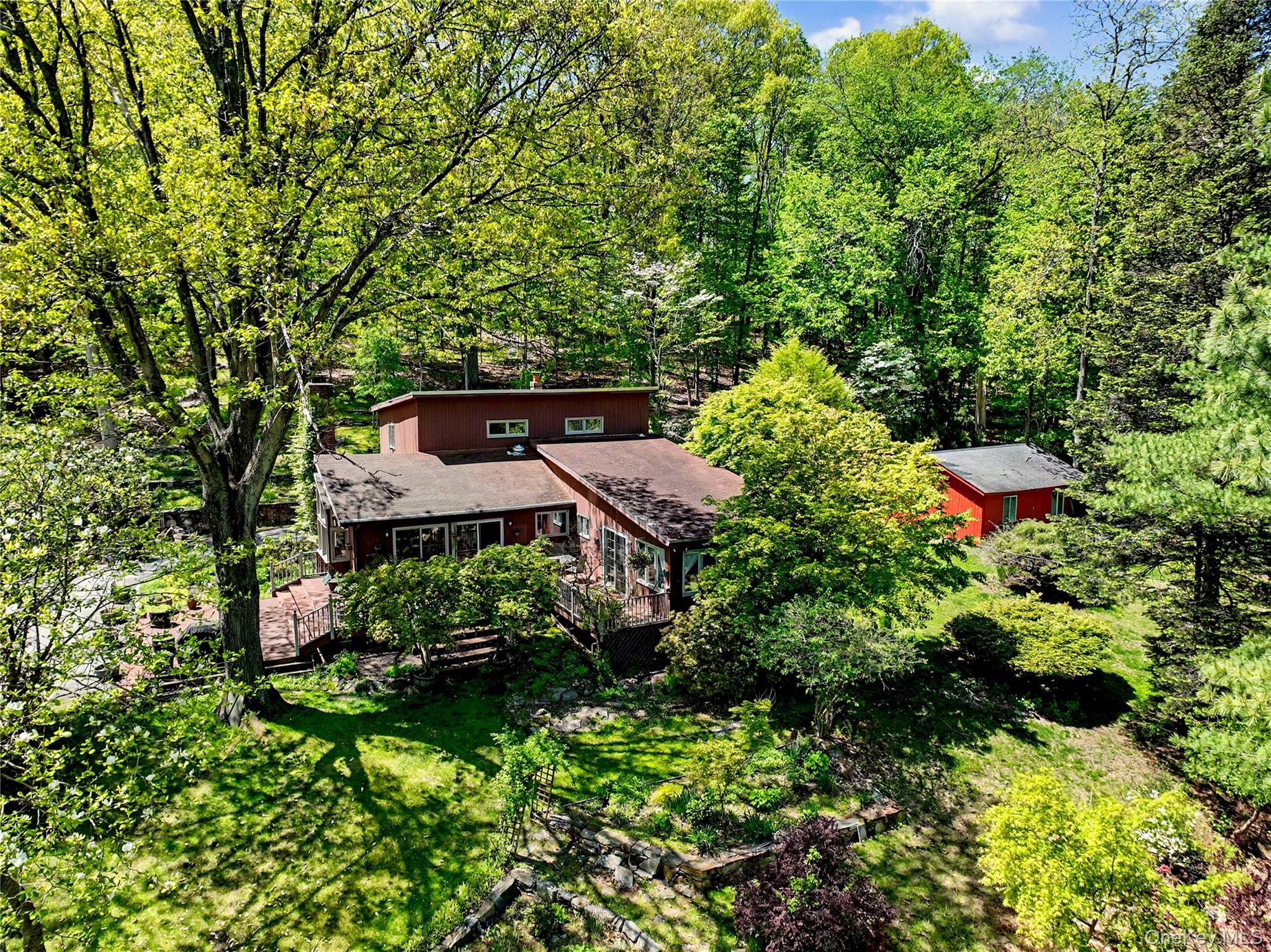 631 Croton Falls Road Carmel, NY 10512 - Photo 29 of 43 an aerial view of a house with swimming pool and garden