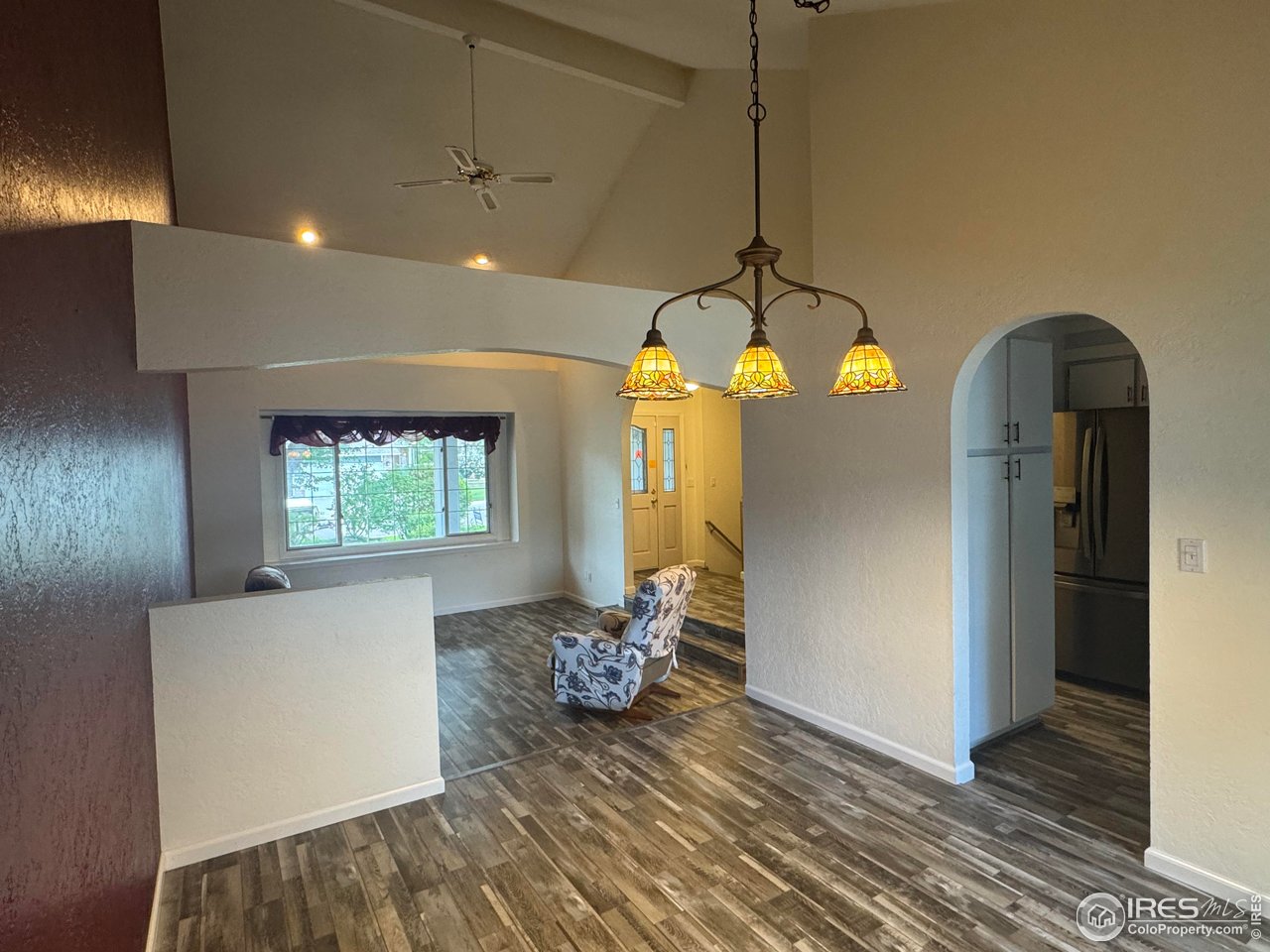 4927 West 6th Street Greeley, CO 80634 - Photo 11 of 34 a view of a room with wooden floor and windows