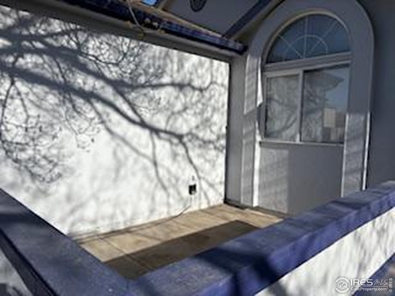 4927 West 6th Street Greeley, CO 80634 - Photo 2 of 34 a bedroom with a bed and wooden floor