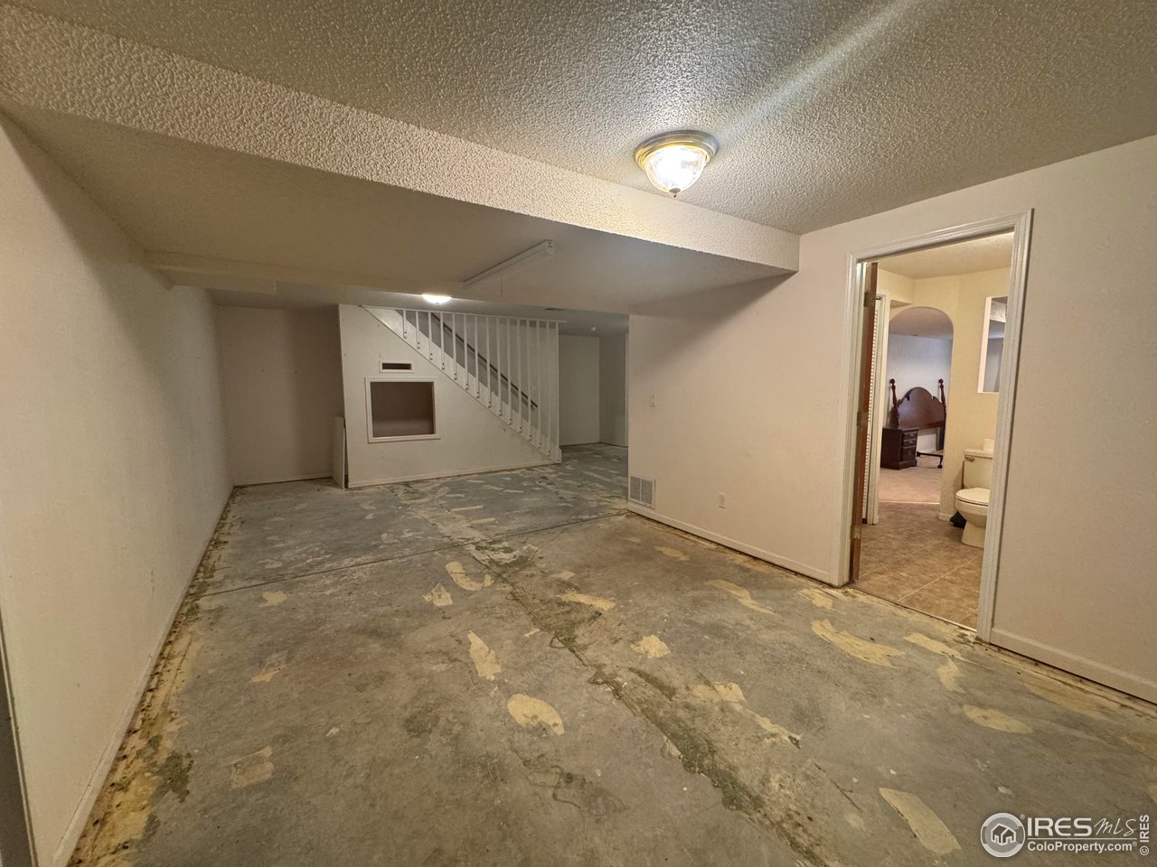 4927 West 6th Street Greeley, CO 80634 - Photo 23 of 34 wooden floor in an empty room