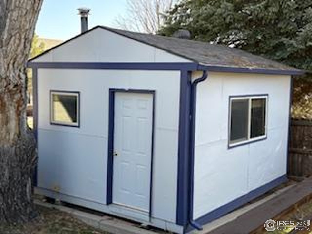 4927 West 6th Street Greeley, CO 80634 - Photo 3 of 34 a front view of a house with a yard