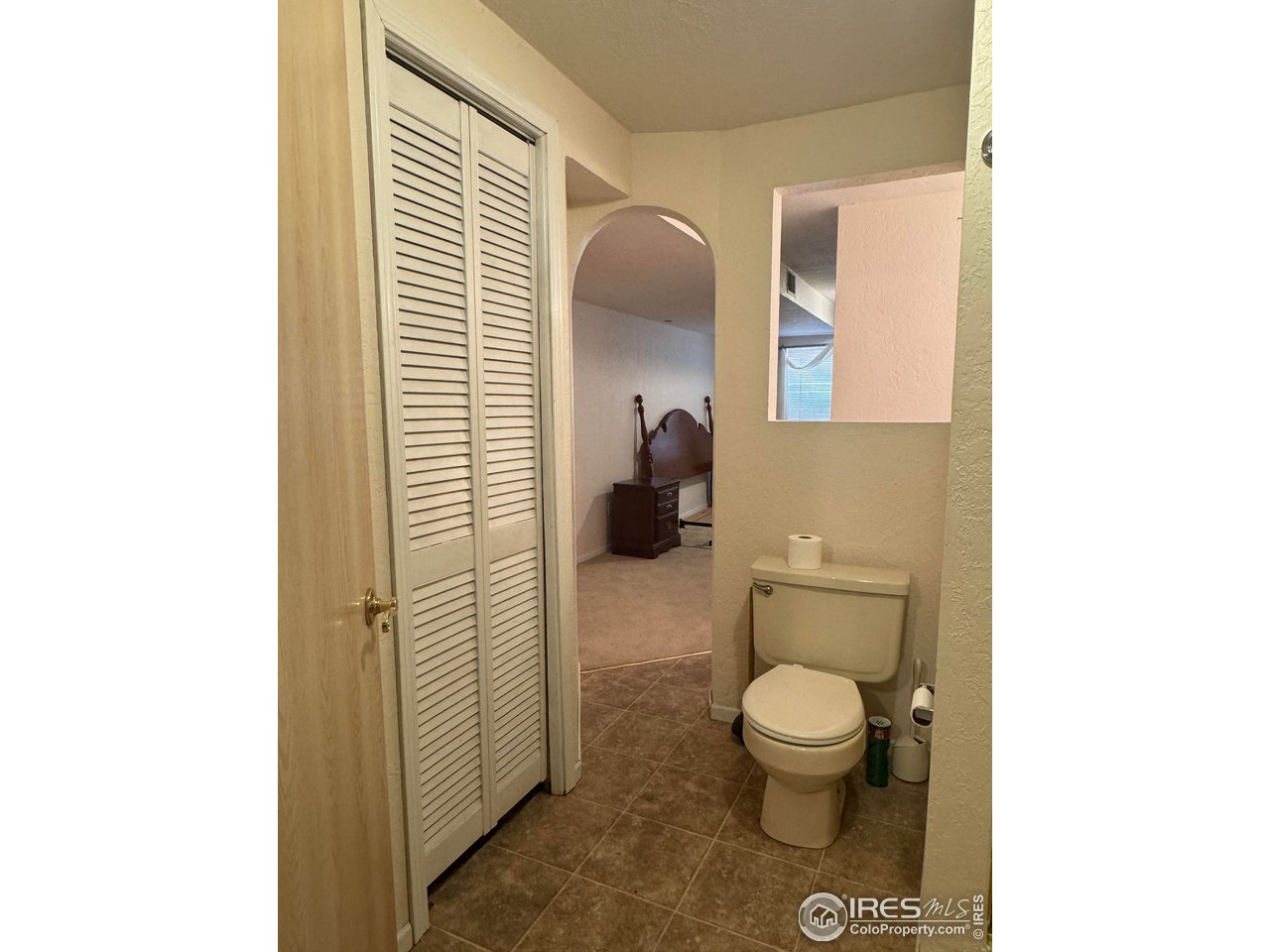 4927 West 6th Street Greeley, CO 80634 - Photo 33 of 34 a bathroom with a toilet and a sink