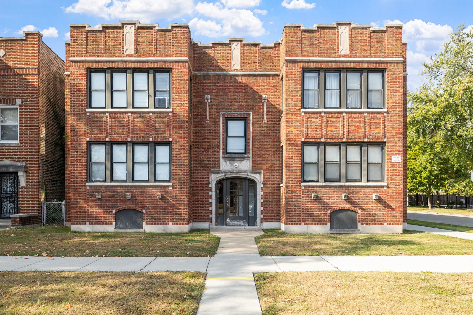 7202 South Indiana Avenue, Unit 1F Chicago, IL 60619 - Photo 1 of 7 a front view of a house