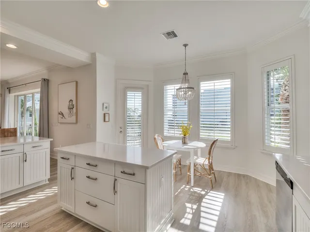 a view of a dining room with furniture and windows