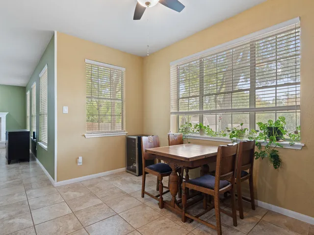 a dining room with furniture and window