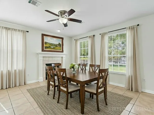 a view of a dining room with furniture window and outside view