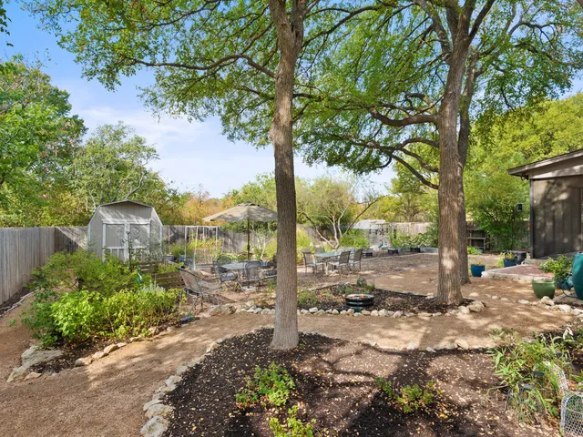 a view of a street with a tree