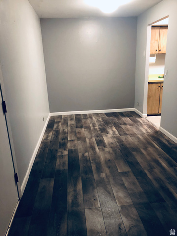 88 West 50 South, Unit B5 Centerville, UT 84014 - Photo 20 of 33 Empty room featuring dark wood finished floors and baseboards
